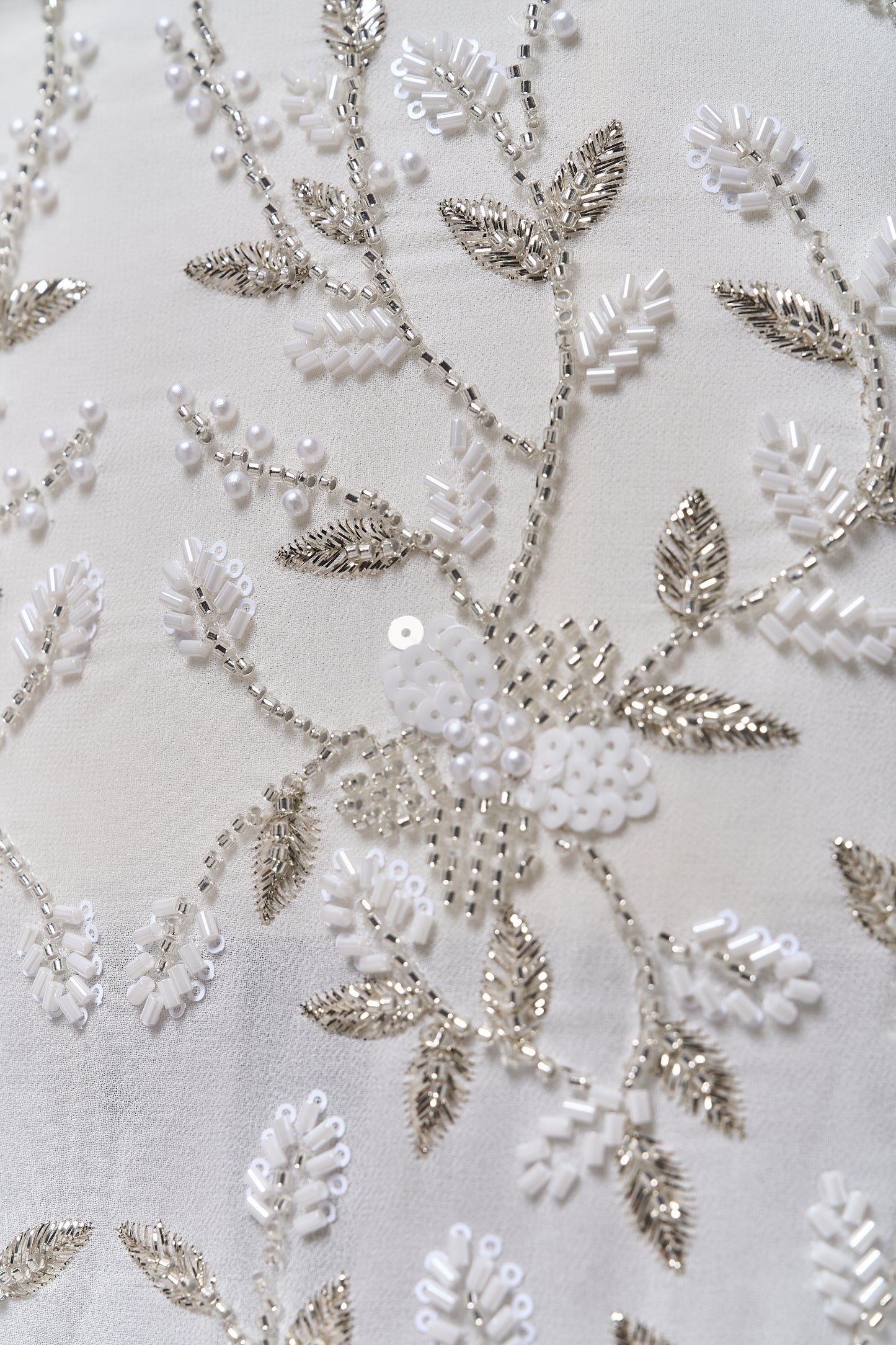 S0710 - Chiffon embroidered with silver metallic thread, silver beads, off-white pearls, long off-white bugle beads, and off-white sequins