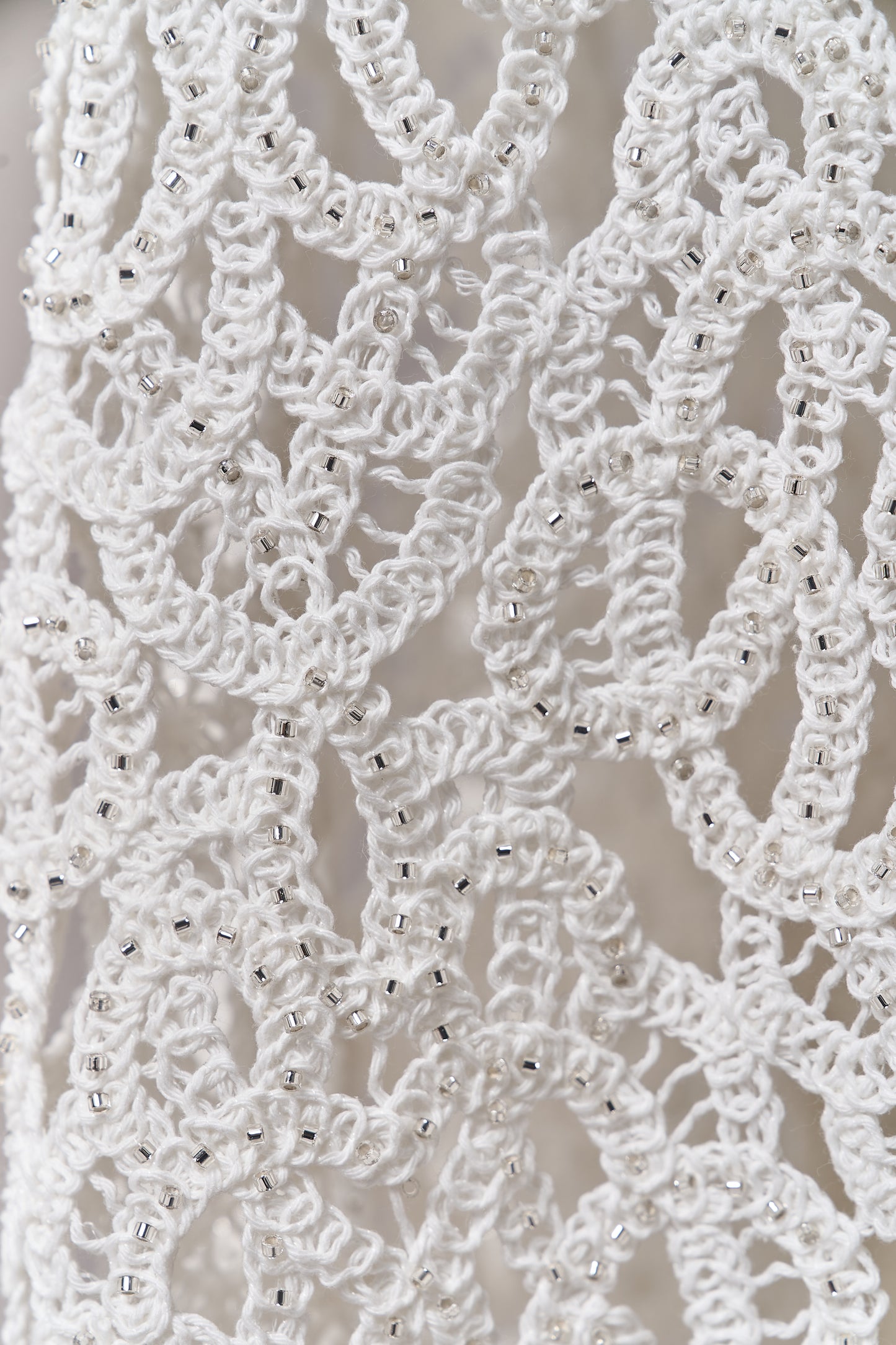 S0713 - Cotton guipure with fringe, embroidered with silver beads