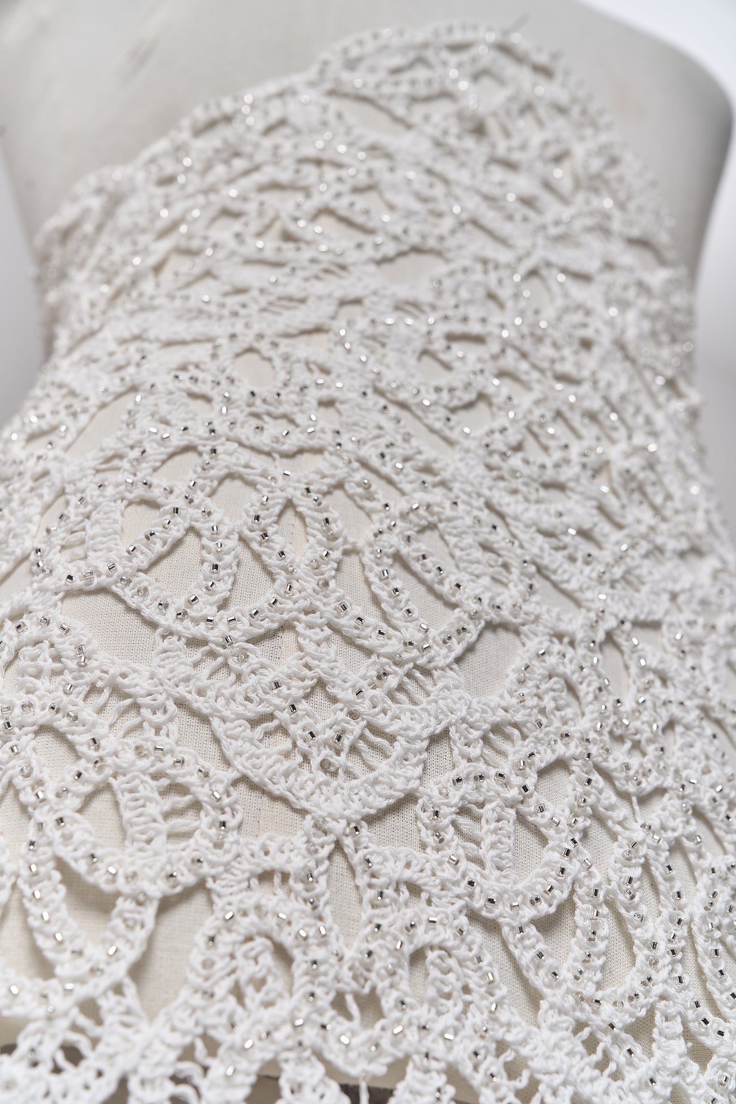 S0713 - Cotton guipure with fringe, embroidered with silver beads