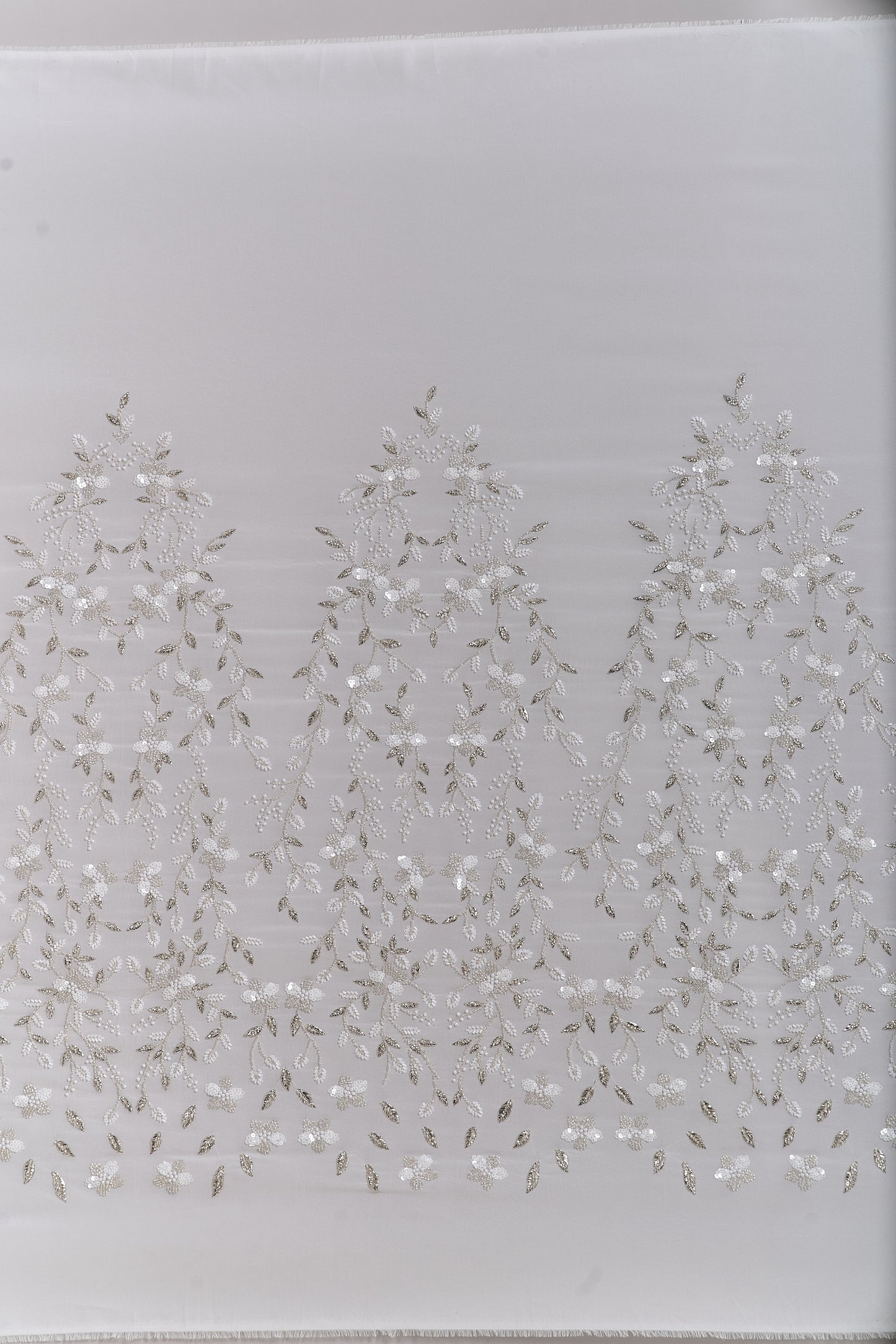 S0710 - Chiffon embroidered with silver metallic thread, silver beads, off-white pearls, long off-white bugle beads, and off-white sequins