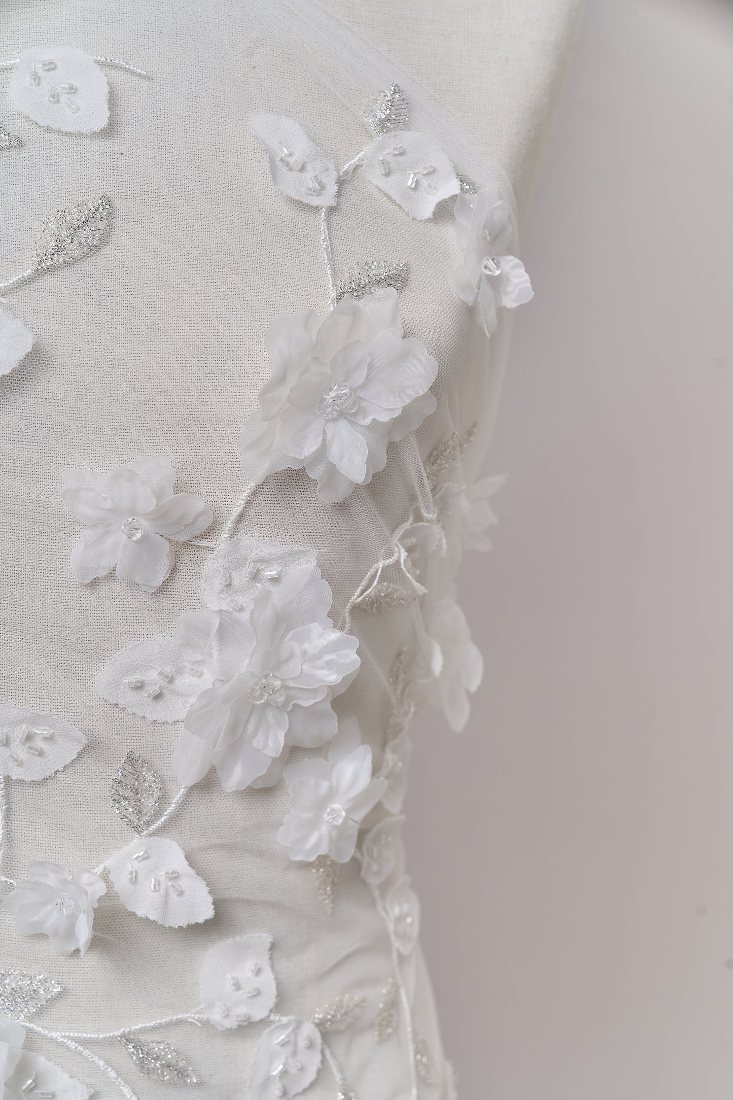 S0699 - Embroidered tulle with 3D organza flowers, 3D chiffon leaves, silver lurex thread, off-white beads, and transparent rhinestones