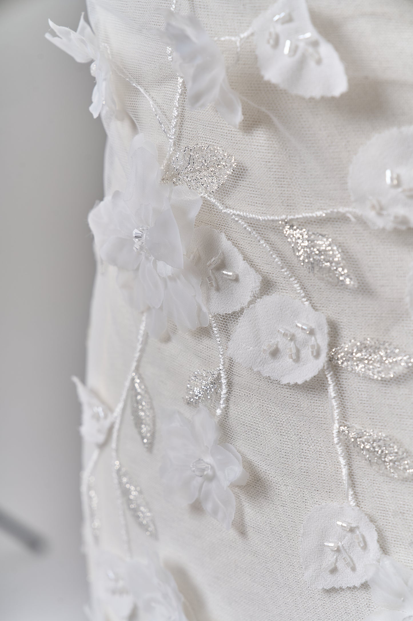 S0699 - Embroidered tulle with 3D organza flowers, 3D chiffon leaves, silver lurex thread, off-white beads, and transparent rhinestones