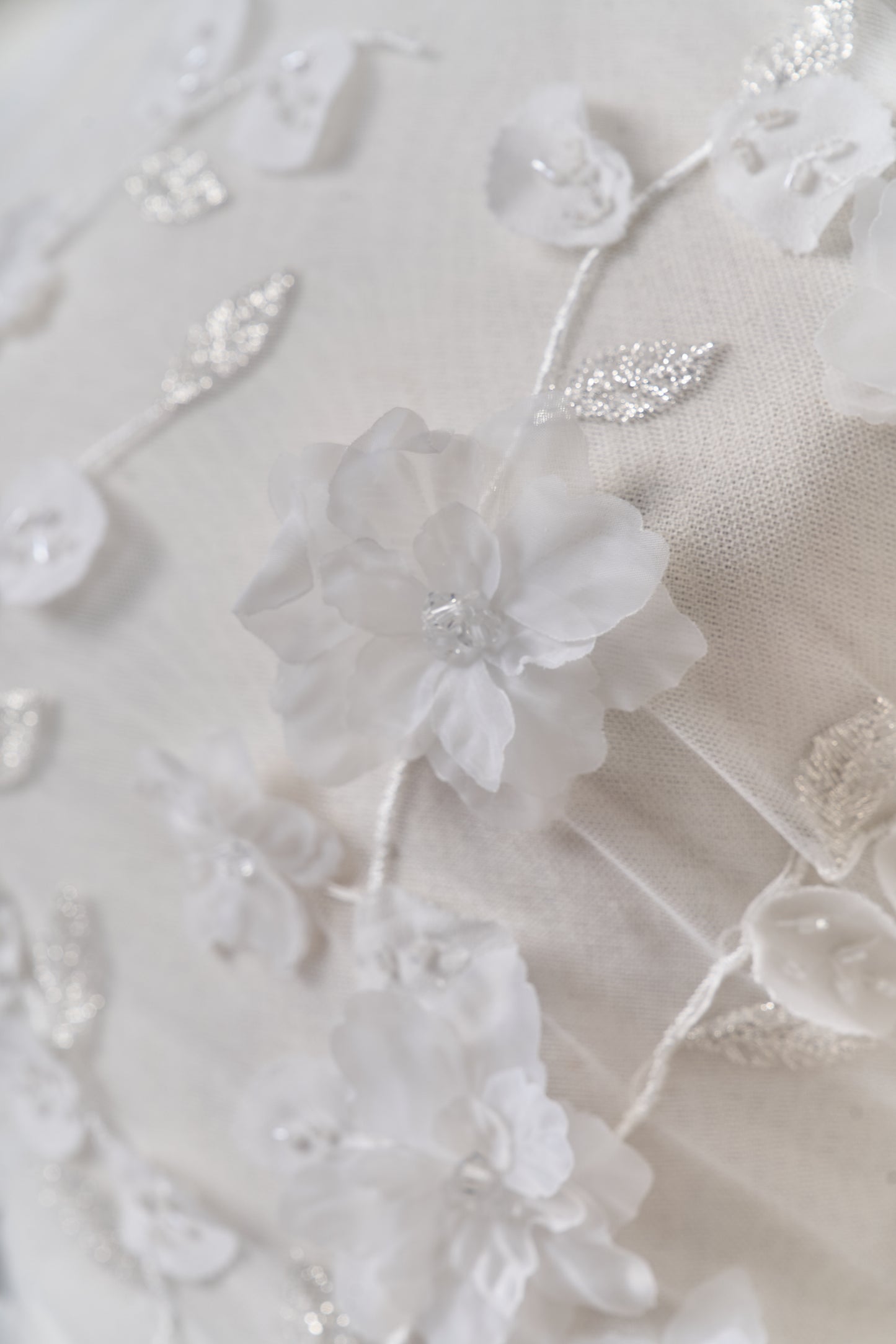 S0699 - Embroidered tulle with 3D organza flowers, 3D chiffon leaves, silver lurex thread, off-white beads, and transparent rhinestones