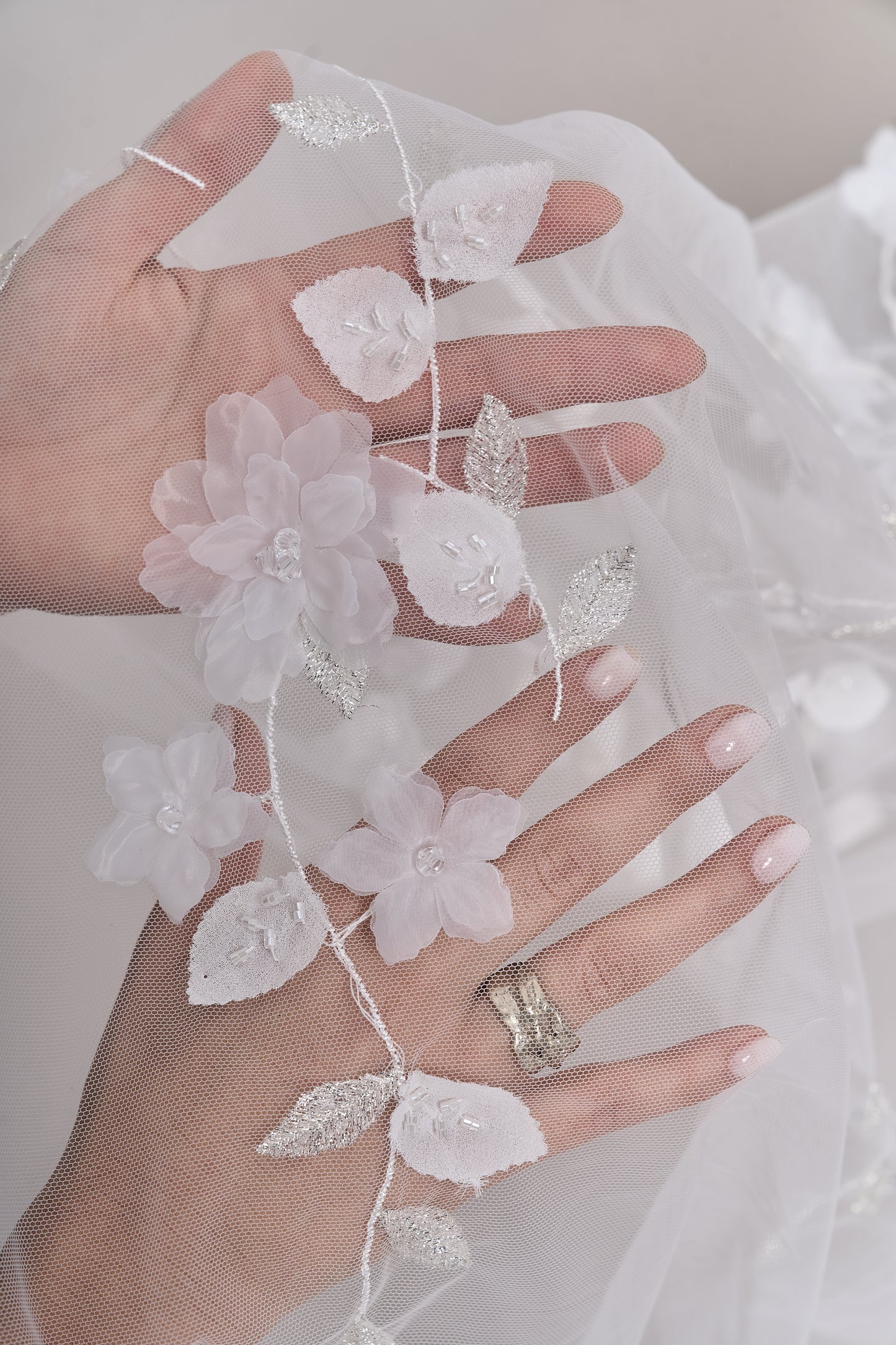 S0699 - Embroidered tulle with 3D organza flowers, 3D chiffon leaves, silver lurex thread, off-white beads, and transparent rhinestones
