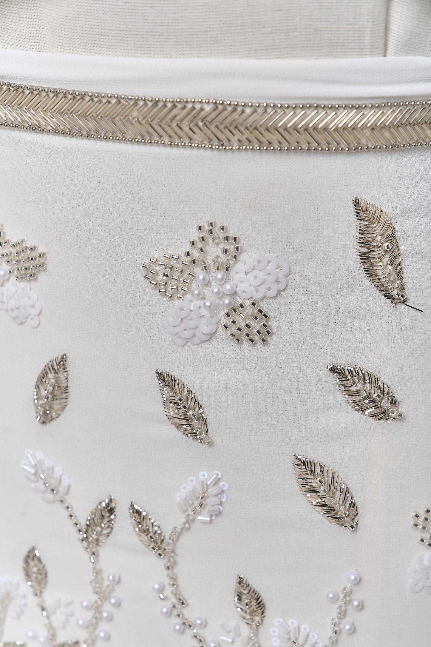 S0710 - Chiffon embroidered with silver metallic thread, silver beads, off-white pearls, long off-white bugle beads, and off-white sequins
