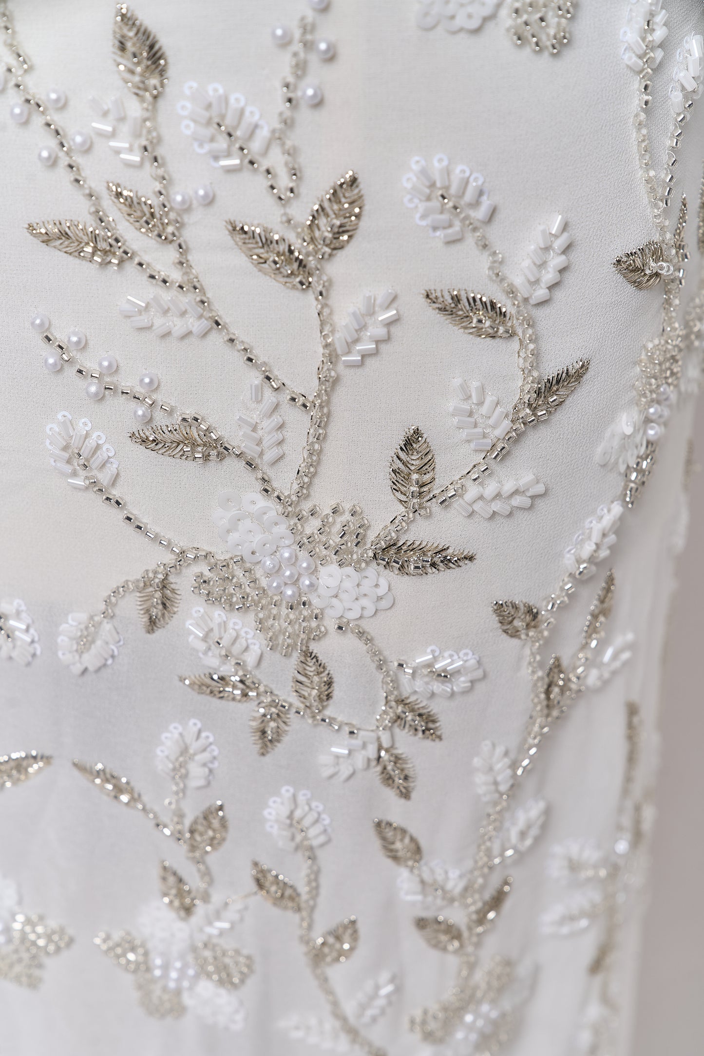 S0710 - Chiffon embroidered with silver metallic thread, silver beads, off-white pearls, long off-white bugle beads, and off-white sequins