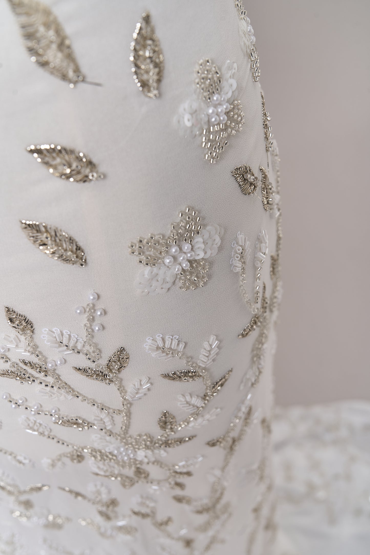 S0710 - Chiffon embroidered with silver metallic thread, silver beads, off-white pearls, long off-white bugle beads, and off-white sequins
