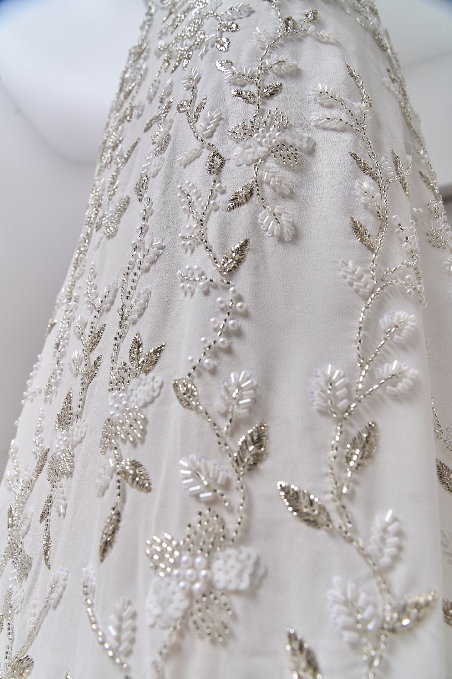 S0710 - Chiffon embroidered with silver metallic thread, silver beads, off-white pearls, long off-white bugle beads, and off-white sequins