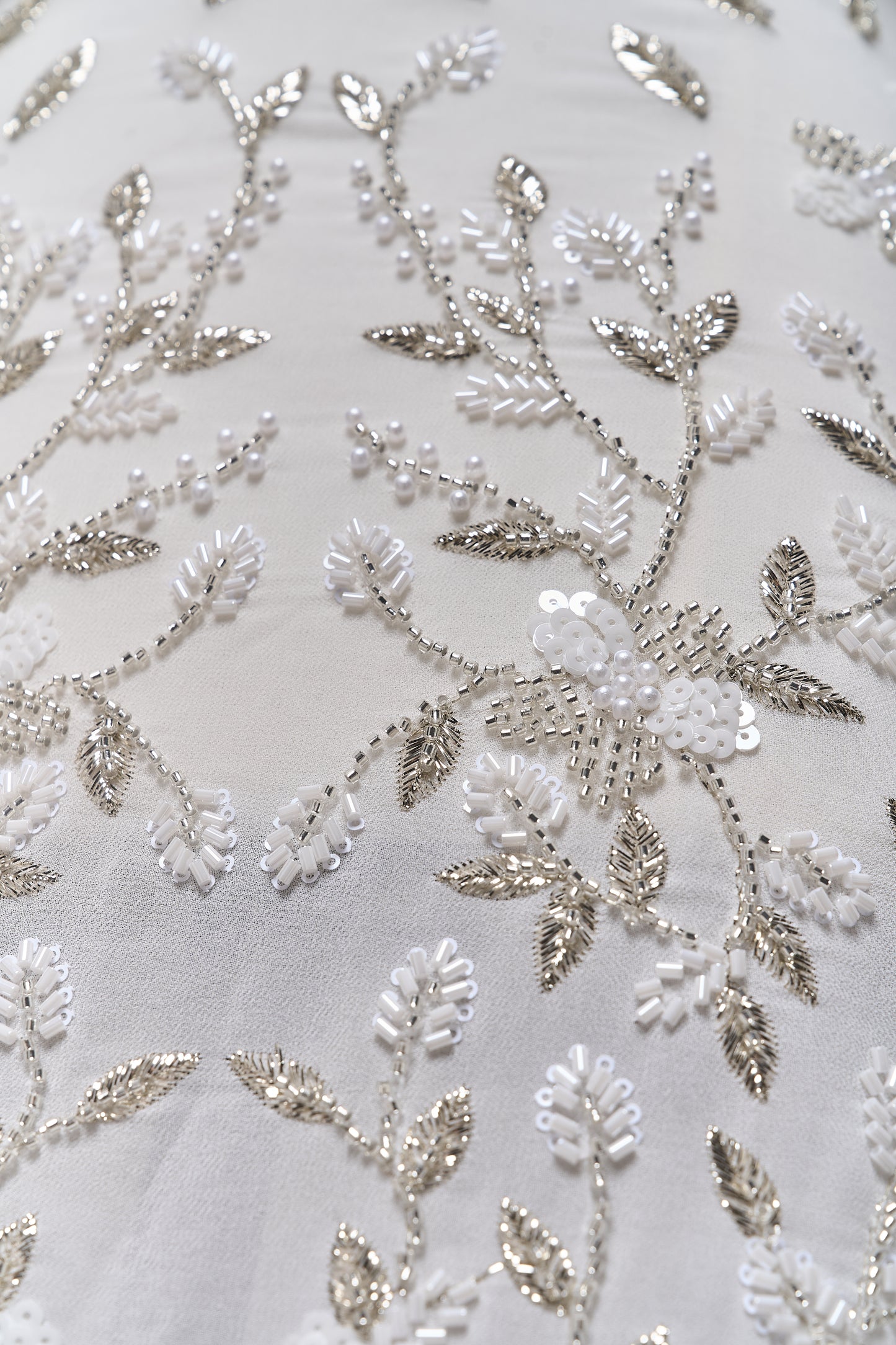 S0710 - Chiffon embroidered with silver metallic thread, silver beads, off-white pearls, long off-white bugle beads, and off-white sequins