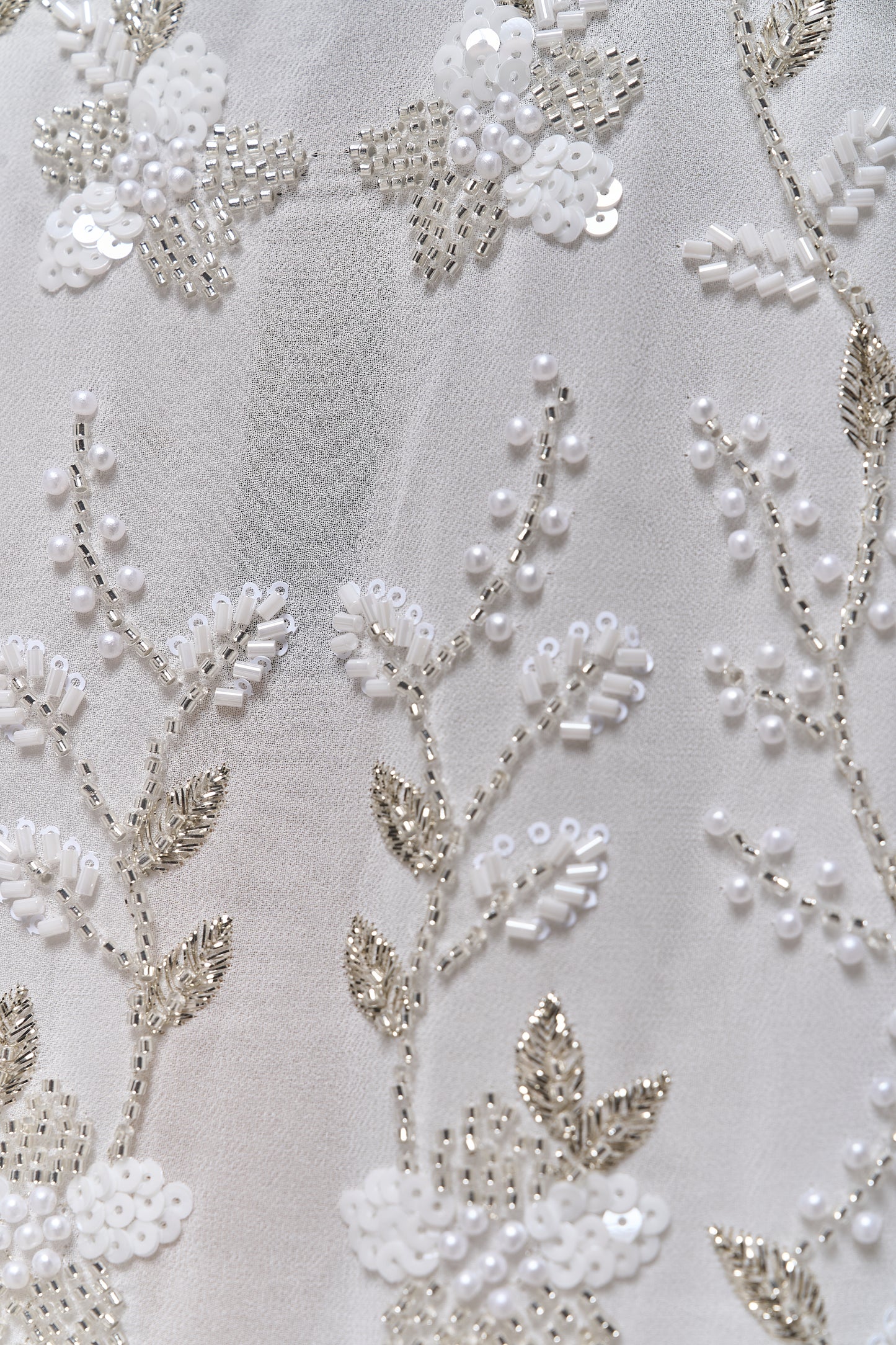 S0710 - Chiffon embroidered with silver metallic thread, silver beads, off-white pearls, long off-white bugle beads, and off-white sequins