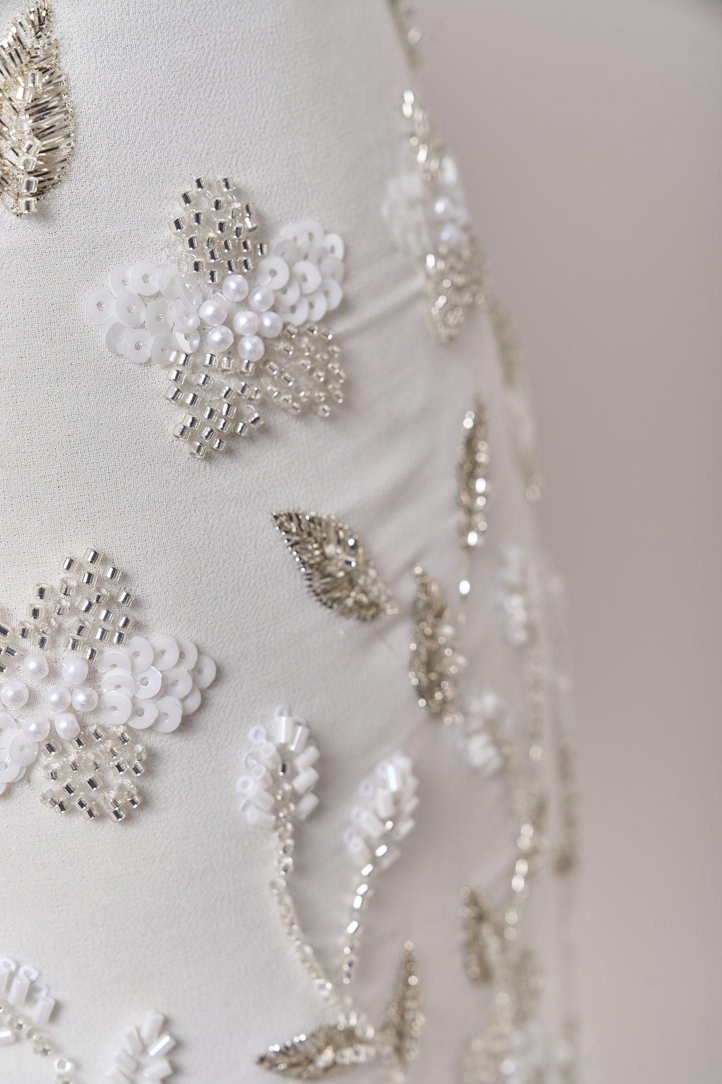 S0710 - Chiffon embroidered with silver metallic thread, silver beads, off-white pearls, long off-white bugle beads, and off-white sequins