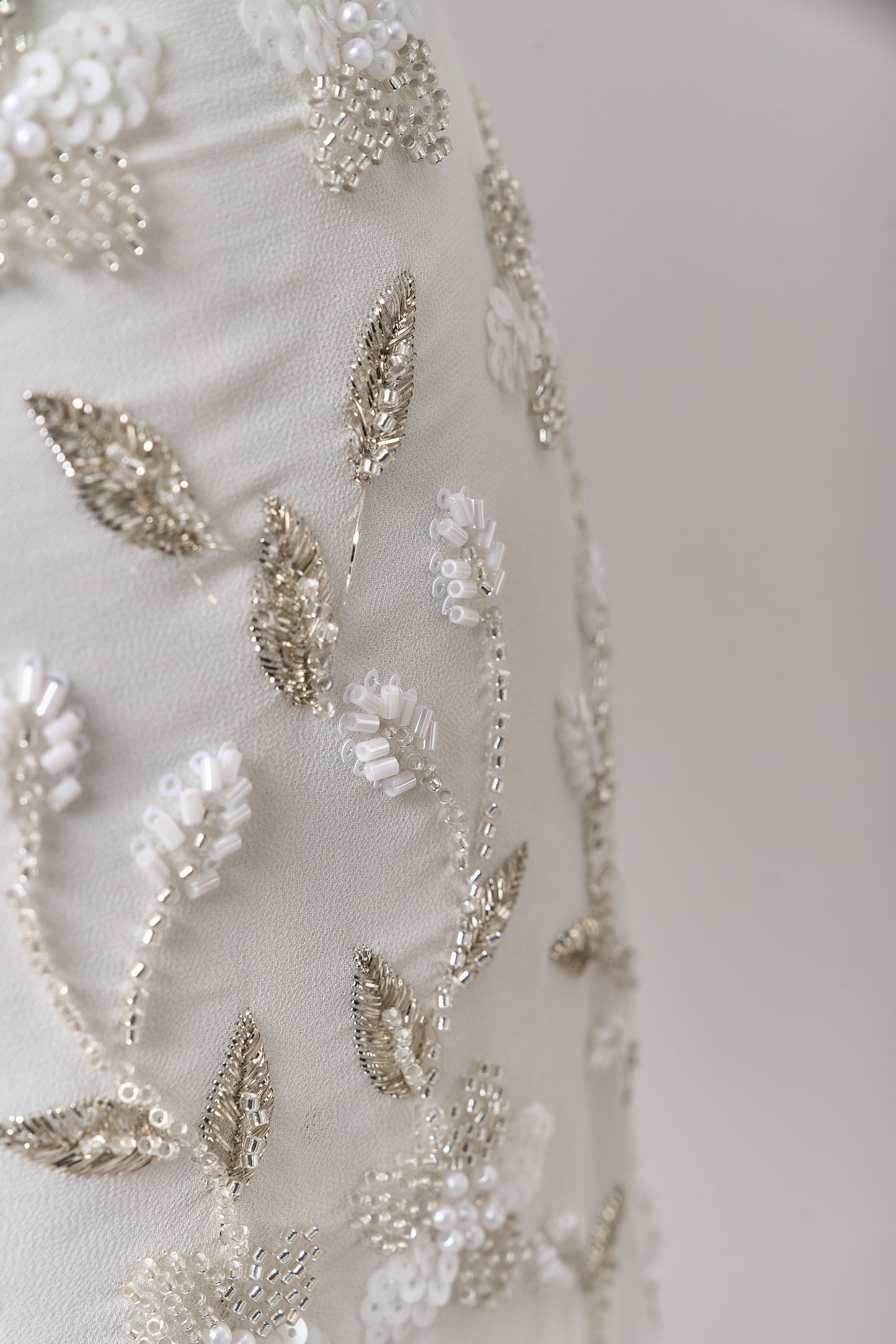 S0710 - Chiffon embroidered with silver metallic thread, silver beads, off-white pearls, long off-white bugle beads, and off-white sequins