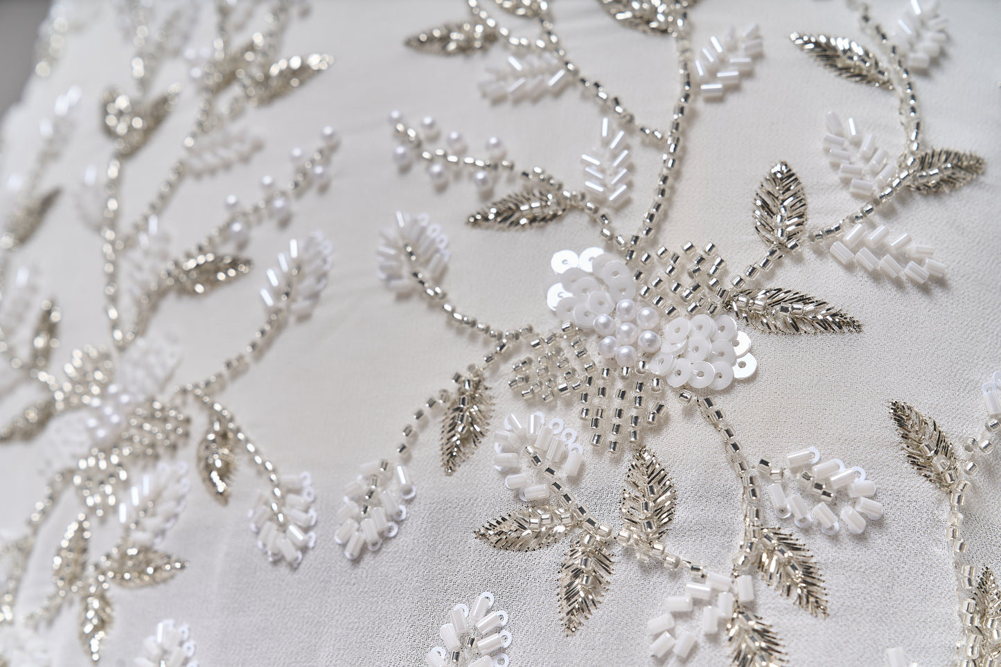 S0710 - Chiffon embroidered with silver metallic thread, silver beads, off-white pearls, long off-white bugle beads, and off-white sequins