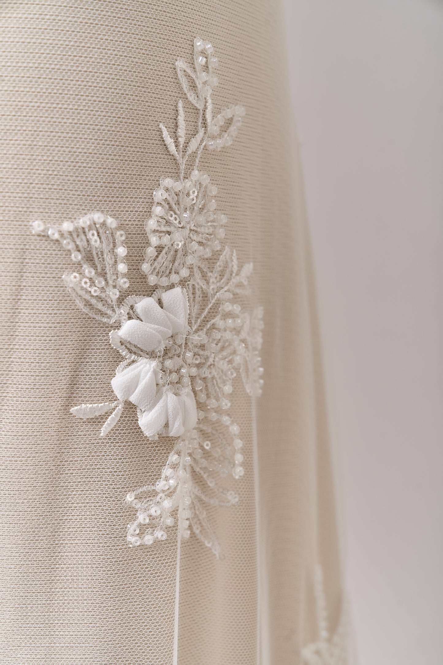 S0689 - Embroidered tulle with 3D chiffon flowers, off-white beads, and transparent sequins