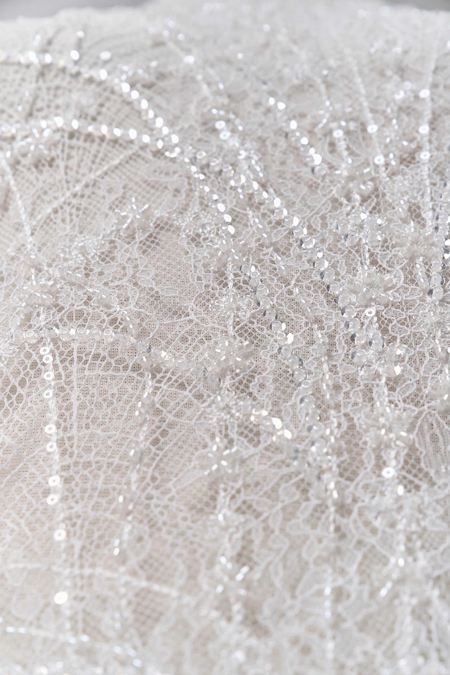 S0677 - Embroidered lace with off-white beads, transparent and silver sequins