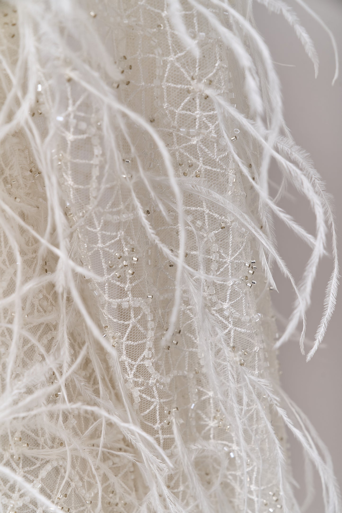 S0680 - Embroidered tulle with off-white and silver beads, transparent sequins, and real feathers
