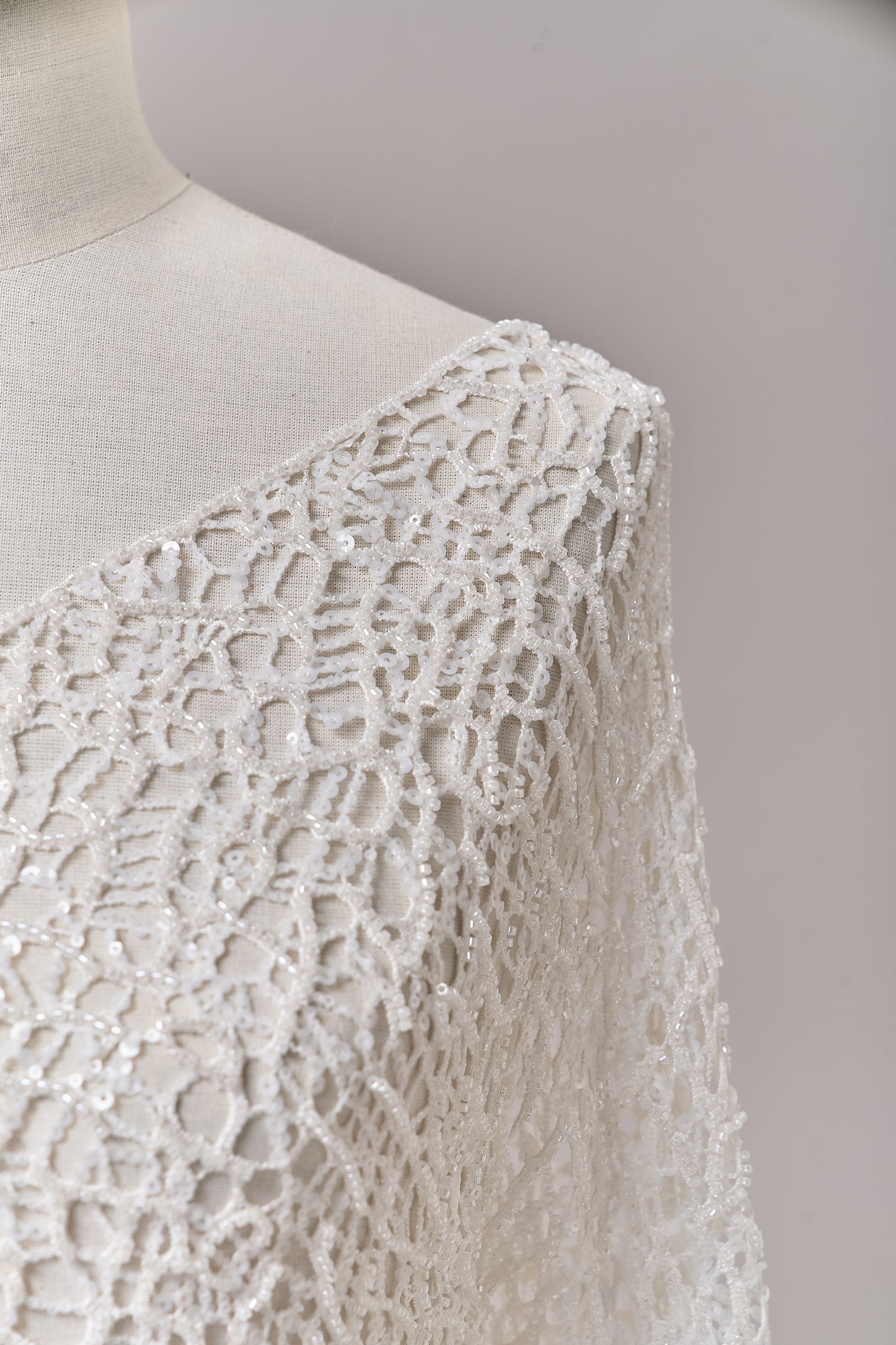 S0687 - Embroidered netting with matte off-white sequins and off-white beads