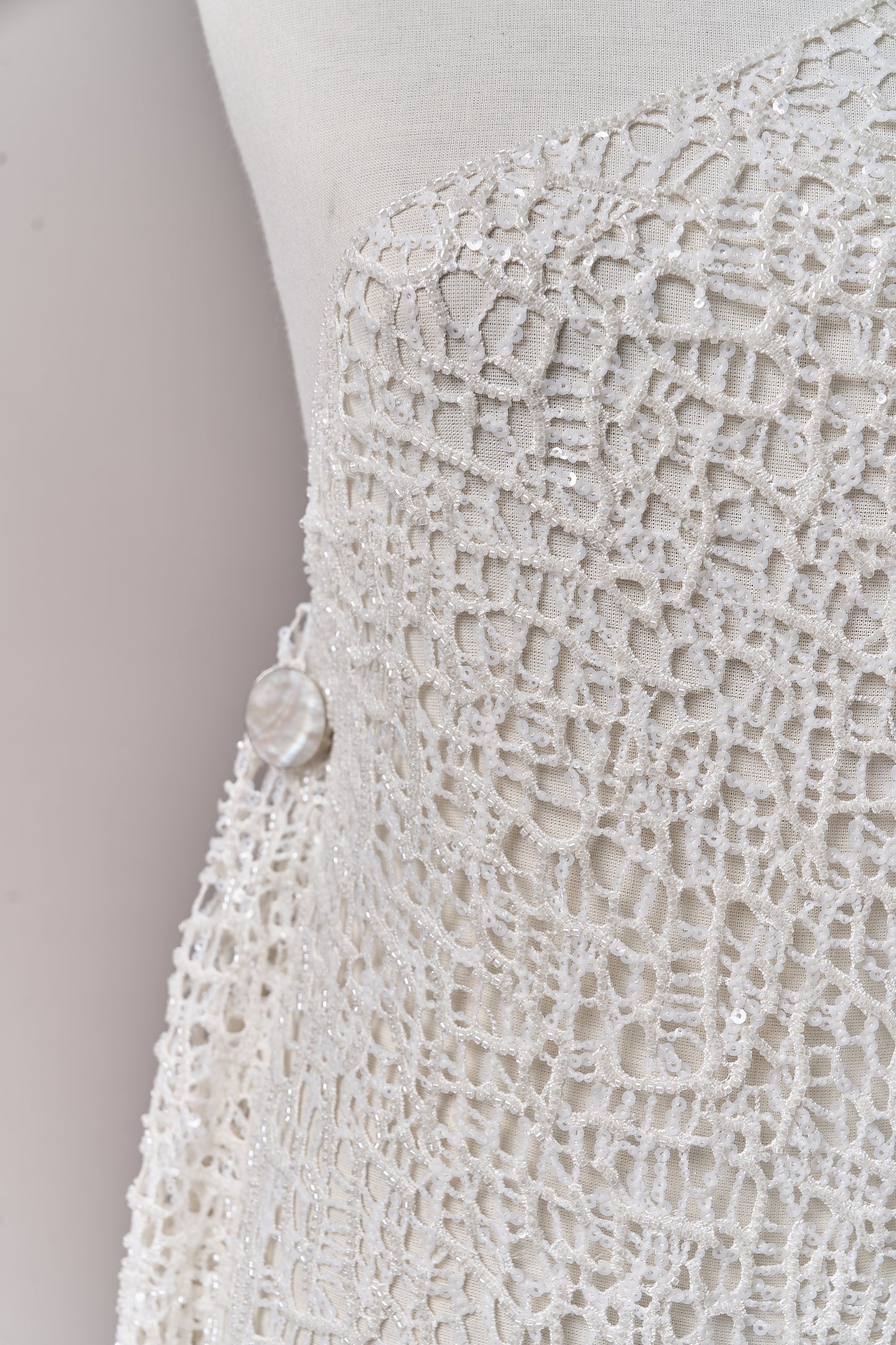 S0687 - Embroidered netting with matte off-white sequins and off-white beads