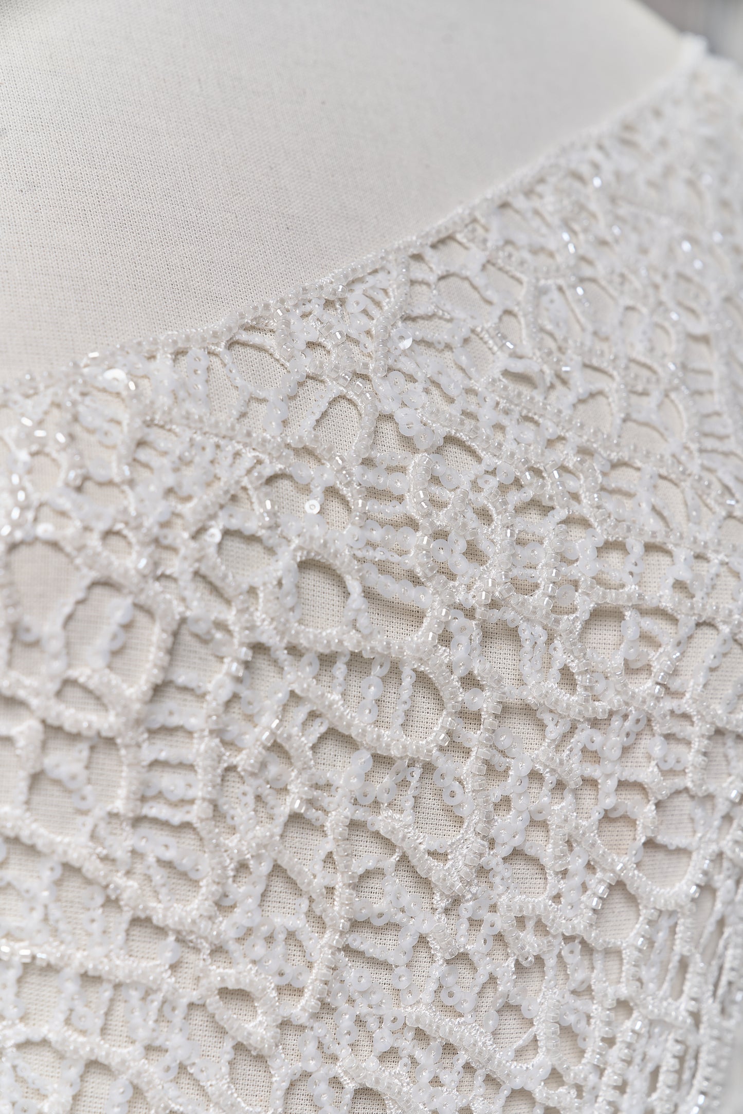 S0687 - Embroidered netting with matte off-white sequins and off-white beads