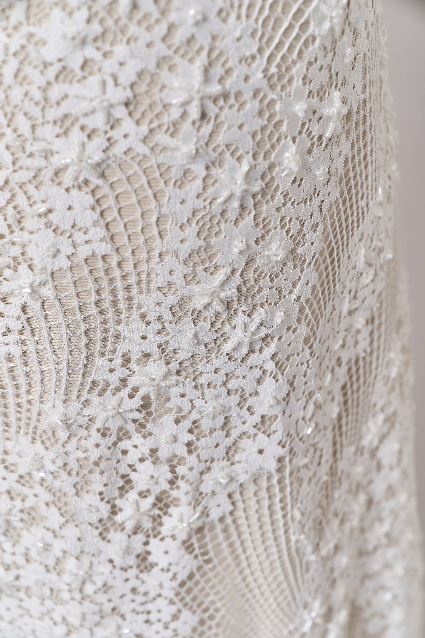 S0679 - Embroidered lace with off-white &nbsp;beads, long off-white bugle beads, and transparent sequins