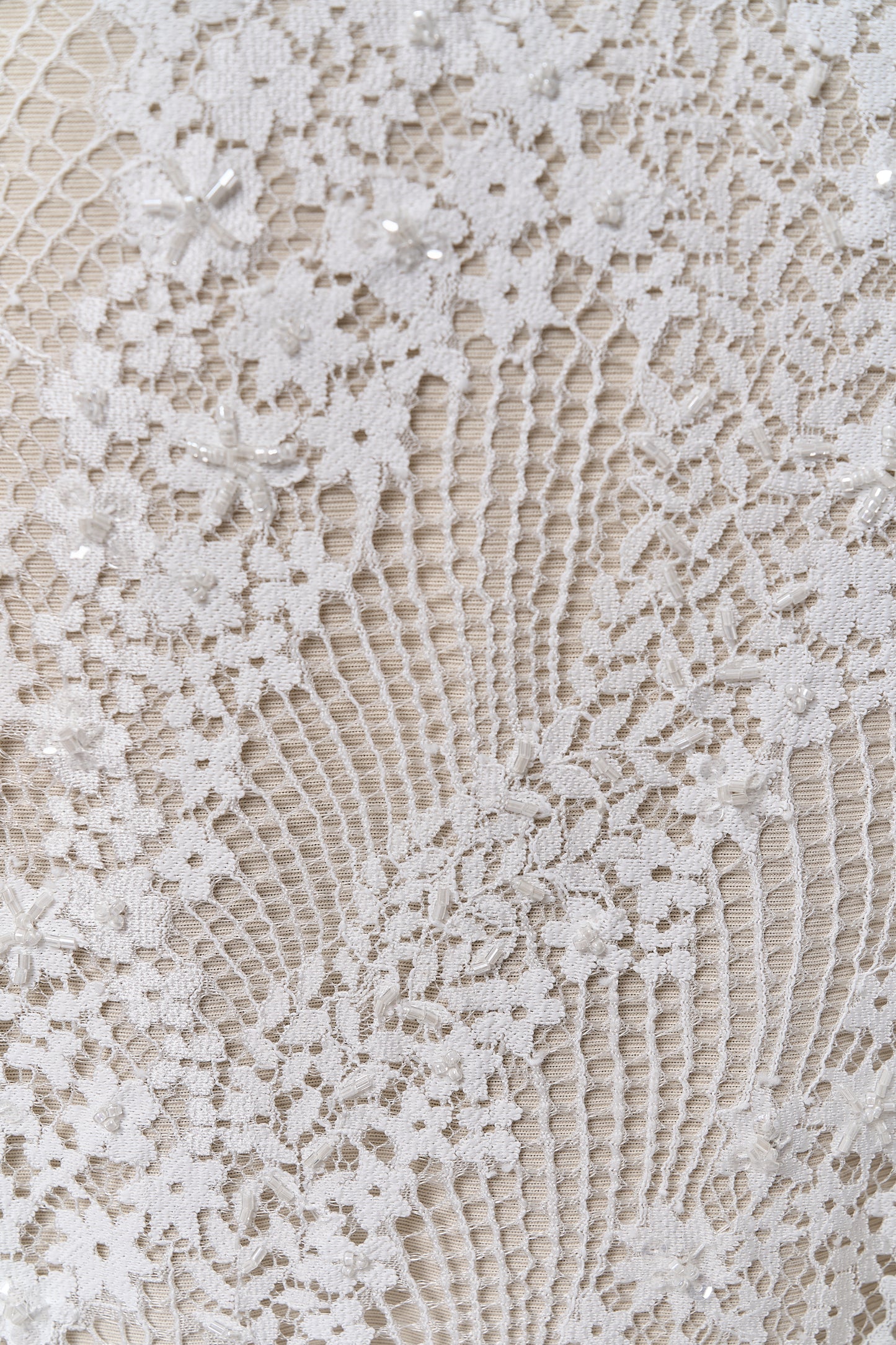 S0679 - Embroidered lace with off-white &nbsp;beads, long off-white bugle beads, and transparent sequins