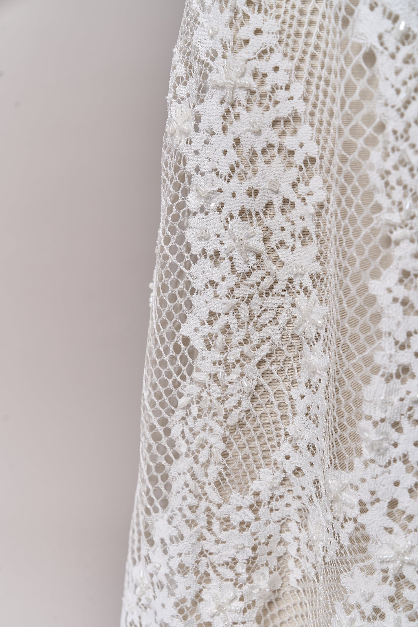 S0679 - Embroidered lace with off-white &nbsp;beads, long off-white bugle beads, and transparent sequins