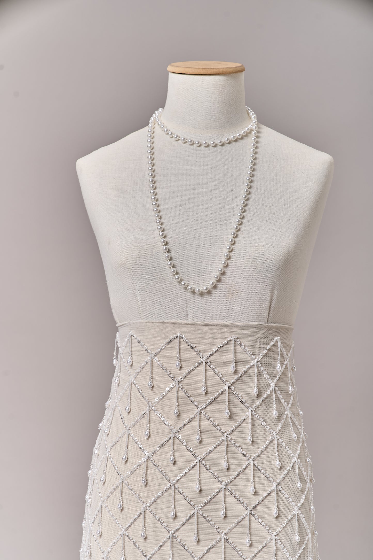 S0709 - Embroidered tulle with off-white beads, silver sequins, long off-white bugle bead fringe, transparent rhinestones, and nacre pearls