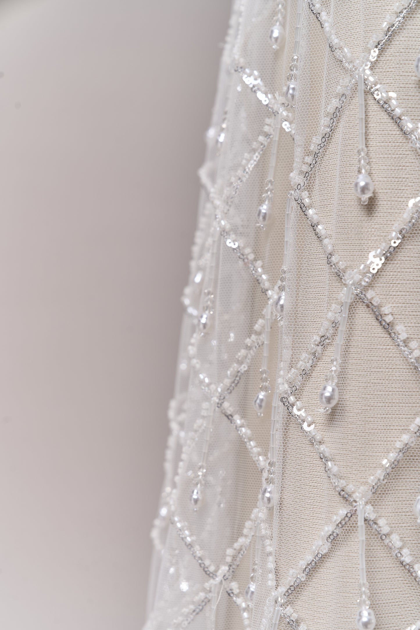 S0709 - Embroidered tulle with off-white beads, silver sequins, long off-white bugle bead fringe, transparent rhinestones, and nacre pearls
