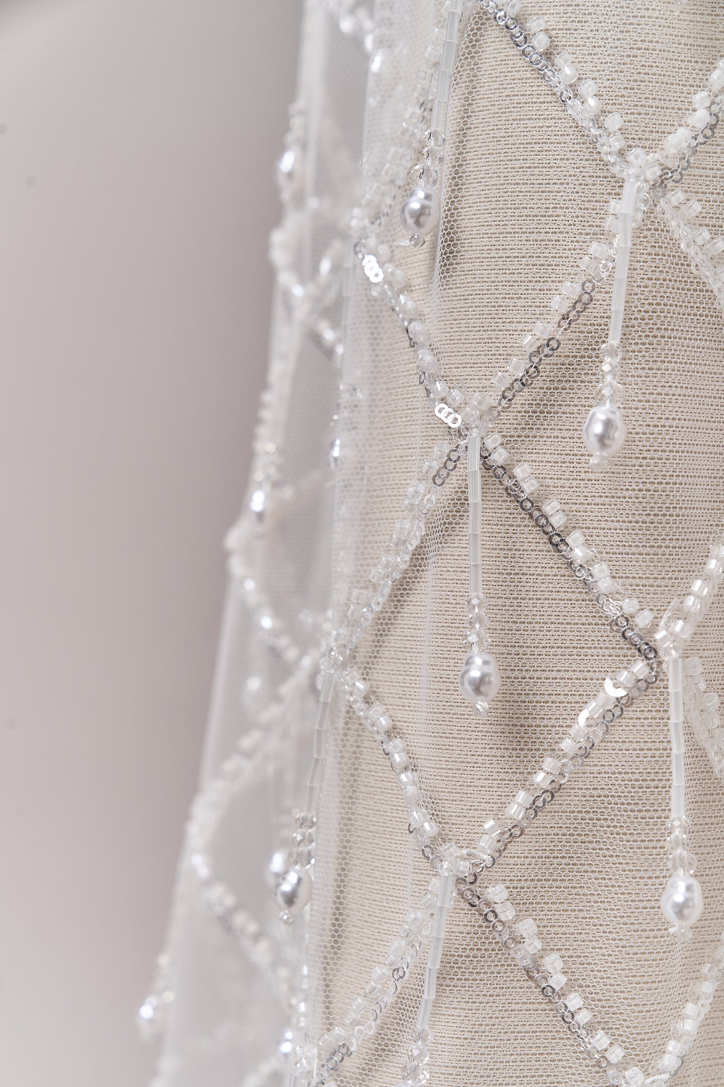 S0709 - Embroidered tulle with off-white beads, silver sequins, long off-white bugle bead fringe, transparent rhinestones, and nacre pearls