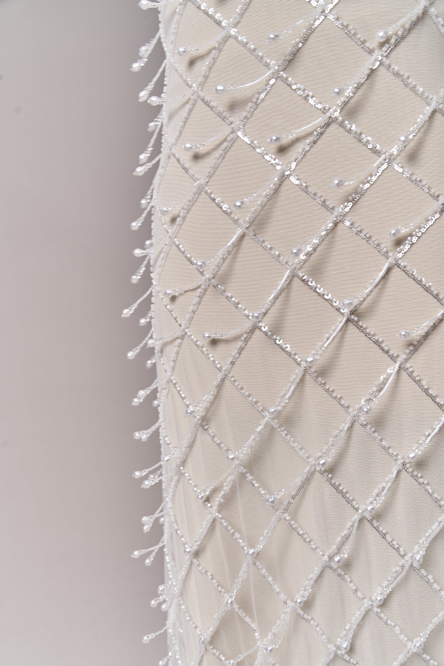 S0709 - Embroidered tulle with off-white beads, silver sequins, long off-white bugle bead fringe, transparent rhinestones, and nacre pearls